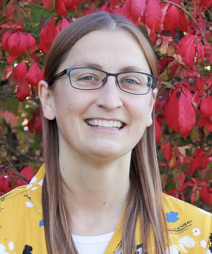 Photo of Sarah McCrobie in front of colorful tree