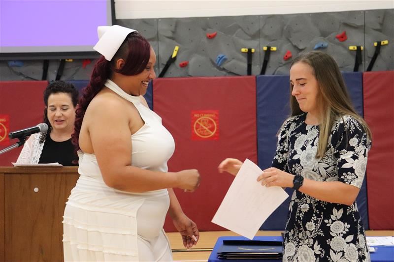  Graduate earns certificate.