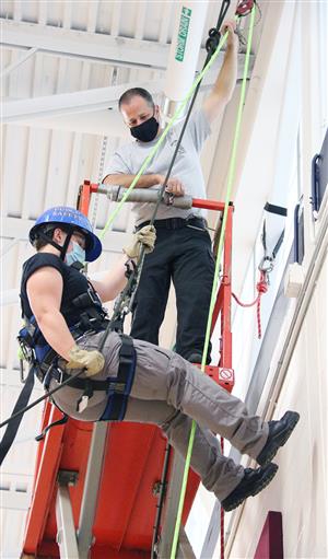 student practices rappelling 